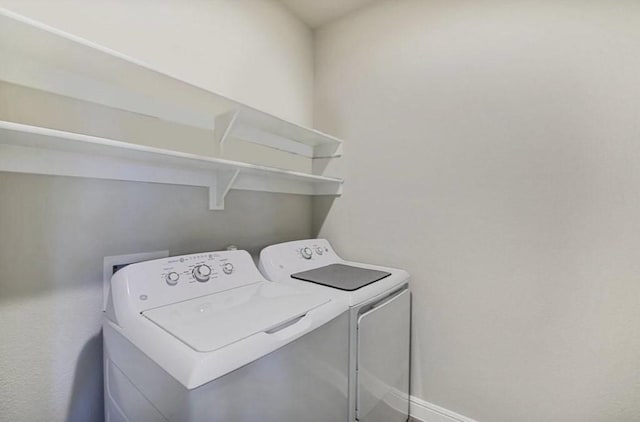 532 Dunmore Dr, Fort Worth, TX 76052 - laundry area with separate washer and dryer and baseboards