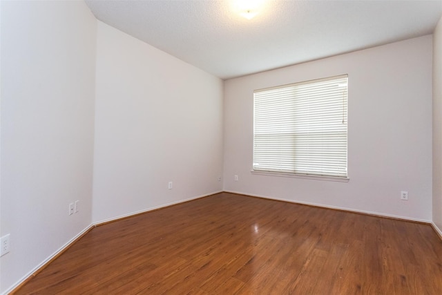 738 Opal Ln, Mesquite, TX 75149 - unfurnished room with wood finished floors and baseboards
