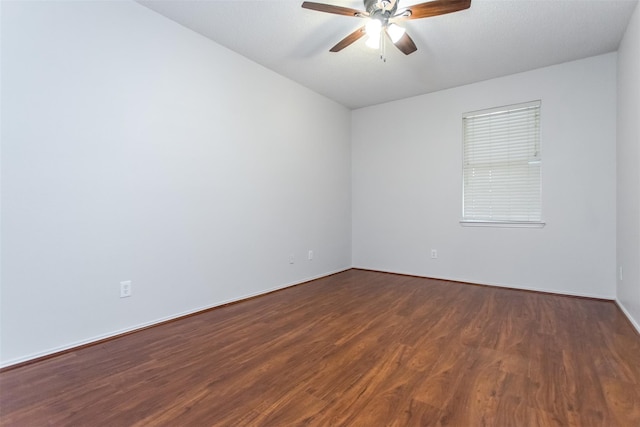 738 Opal Ln, Mesquite, TX 75149 - empty room with a ceiling fan and dark wood-style flooring