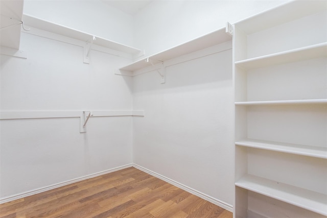 738 Opal Ln, Mesquite, TX 75149 - spacious closet with wood finished floors