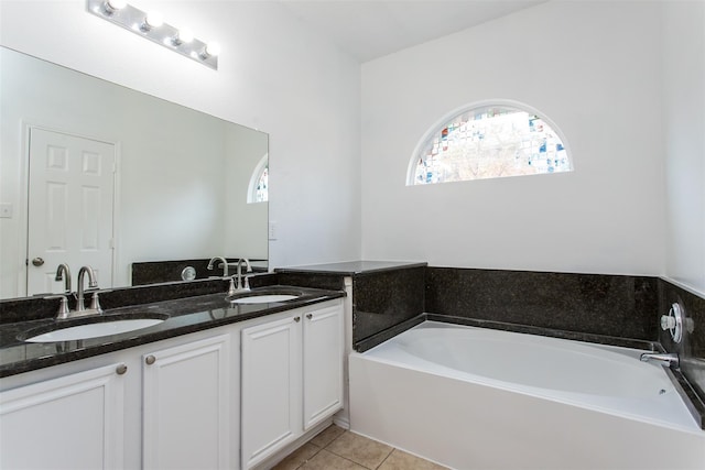 738 Opal Ln, Mesquite, TX 75149 - bathroom featuring double vanity, a bath, and tile patterned flooring