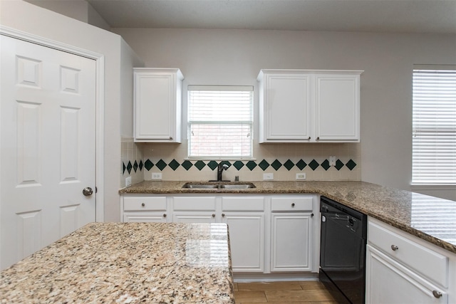 738 Opal Ln, Mesquite, TX 75149 - kitchen featuring black dishwasher, white cabinetry, backsplash, and light stone countertops