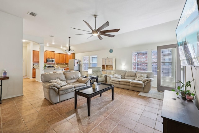 504 Lake Point Dr, Little Elm, TX 75068 - living area with ceiling fan, light tile patterned floors, lofted ceiling, decorative columns, and a chandelier
