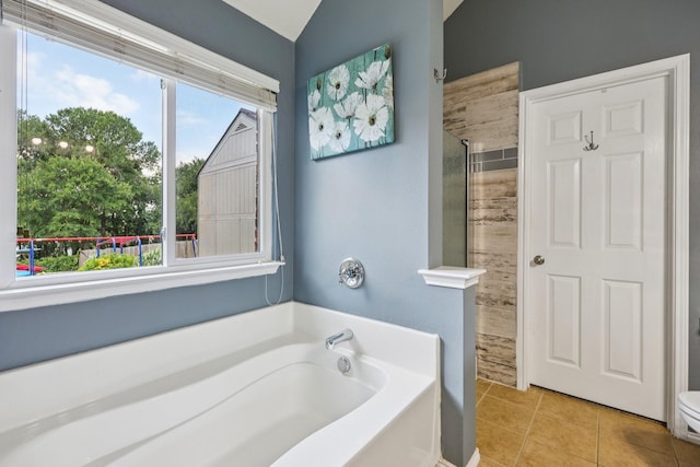 504 Lake Point Dr, Little Elm, TX 75068 - full bathroom featuring a shower stall, a garden tub, tile patterned floors, and lofted ceiling