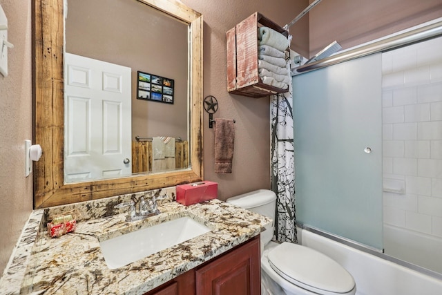 504 Lake Point Dr, Little Elm, TX 75068 - full bathroom featuring vanity, bath / shower combo with glass door, and a textured wall