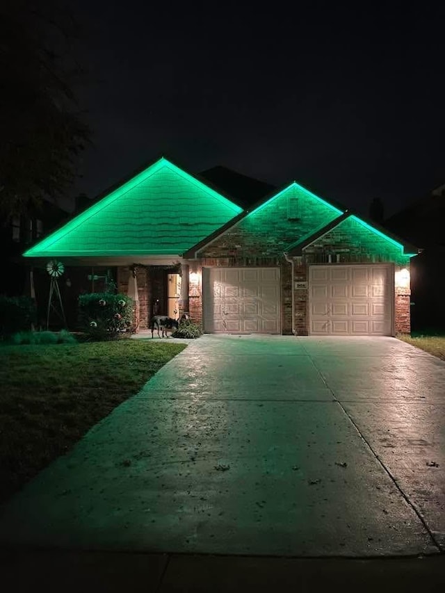 504 Lake Point Dr, Little Elm, TX 75068 - ranch-style house featuring a garage, driveway, and brick siding