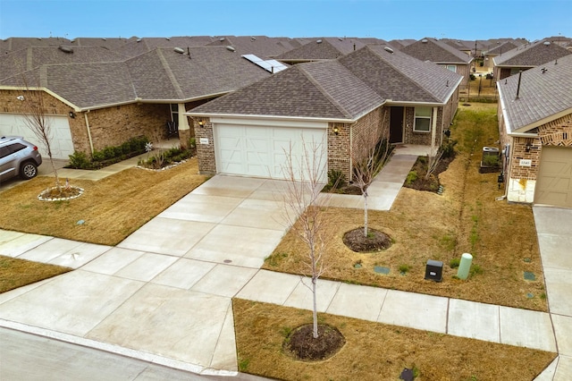 1244 Eagle Ln, Little Elm, TX 76227 - view of front of property featuring brick siding, roof with shingles, and a garage