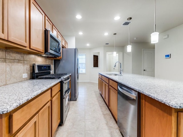 1244 Eagle Ln, Little Elm, TX 76227 - kitchen featuring appliances with stainless steel finishes, backsplash, recessed lighting, light tile patterned flooring, and brown cabinets