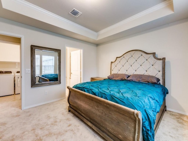 1244 Eagle Ln, Little Elm, TX 76227 - bedroom featuring washer and clothes dryer, light colored carpet, ornamental molding, and a tray ceiling
