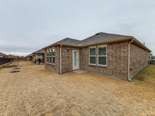 1244 Eagle Ln, Little Elm, TX 76227 - back of property with brick siding and roof with shingles