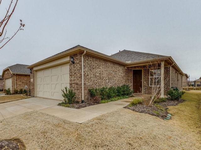 1244 Eagle Ln, Little Elm, TX 76227 - single story home featuring brick siding, an attached garage, and concrete driveway