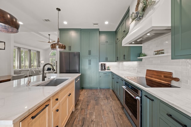 1402 Summer Dell Ct, Keller, TX 76262 - kitchen featuring appliances with stainless steel finishes, premium range hood, green cabinetry, dark wood finished floors, and recessed lighting