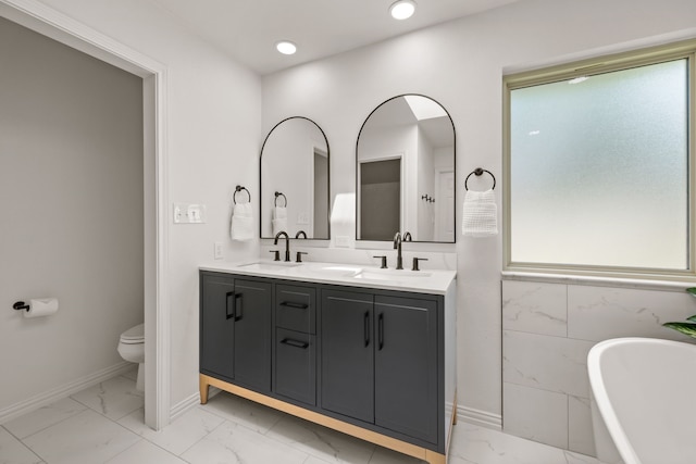 1402 Summer Dell Ct, Keller, TX 76262 - bathroom with marble look tiles, double vanity, a freestanding bath, and recessed lighting