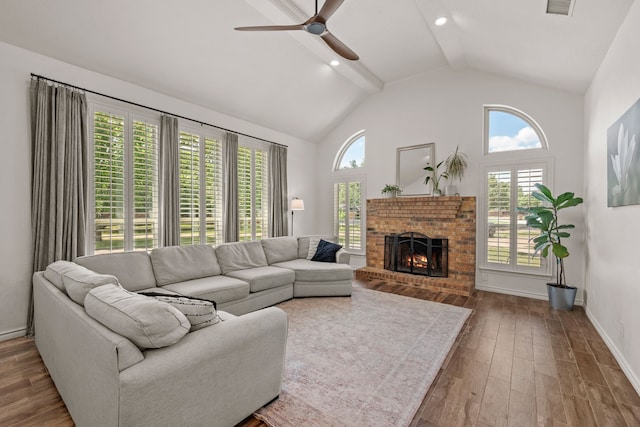 1402 Summer Dell Ct, Keller, TX 76262 - living room featuring ceiling fan, wood finished floors, beam ceiling, a fireplace, and high vaulted ceiling