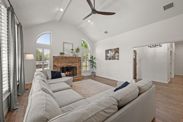 1402 Summer Dell Ct, Keller, TX 76262 - living area with ceiling fan, beamed ceiling, wood finished floors, a fireplace, and high vaulted ceiling