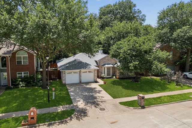 2521 Misty Glen Dr, Flower Mound, TX 75028 - view of front of property with driveway, an attached garage, and brick siding