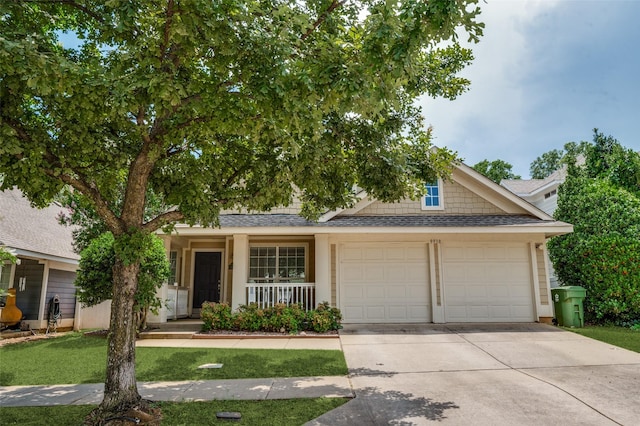9938 Wethers Field Cir, Providence Village, TX 76227 - view of front facade featuring a garage, a shingled roof, concrete driveway, covered porch, and a front lawn