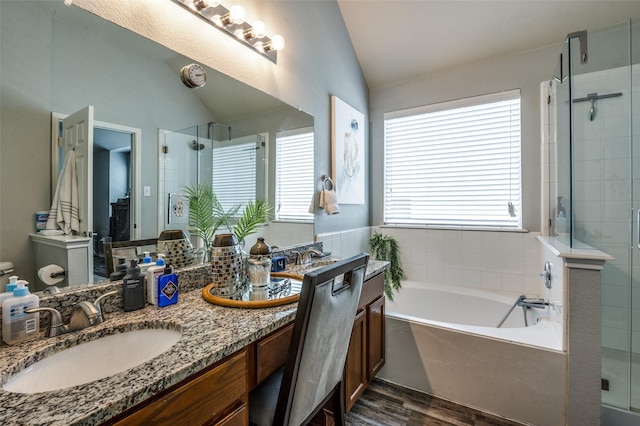 9938 Wethers Field Cir, Providence Village, TX 76227 - full bath with vaulted ceiling, double vanity, a stall shower, and wood finished floors
