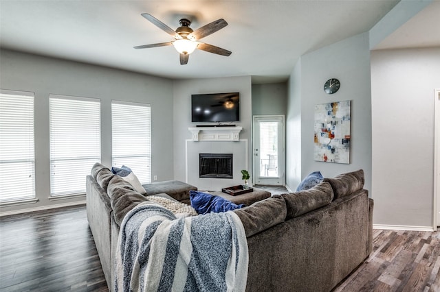 9938 Wethers Field Cir, Providence Village, TX 76227 - living room with a ceiling fan, dark wood-style floors, a fireplace, and healthy amount of natural light
