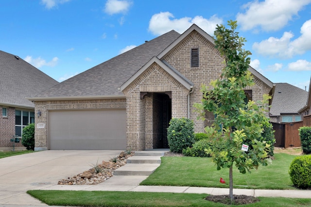 813 Louisville Rd, Savannah, TX 76227 - french country inspired facade featuring brick siding, concrete driveway, and a shingled roof