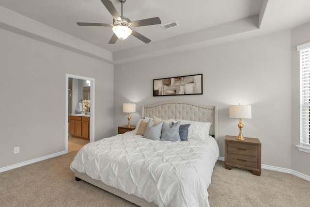 813 Louisville Rd, Savannah, TX 76227 - bedroom with light colored carpet, a raised ceiling, ensuite bathroom, and ceiling fan