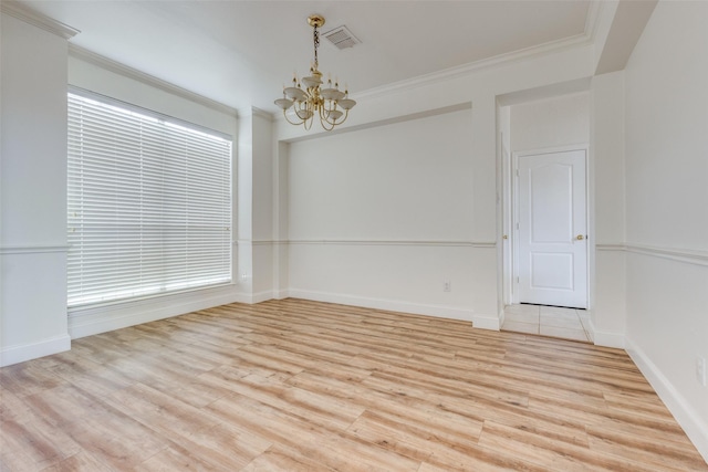 4513 Southpointe Dr, Richardson, TX 75082 - spare room with a chandelier, light wood finished floors, and crown molding