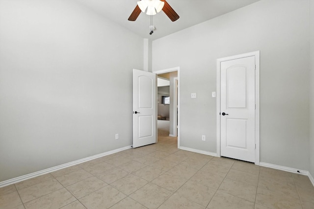 4000 Barnhill Ct, Denton, TX 76208 - unfurnished bedroom with a high ceiling, light tile patterned floors, and ceiling fan