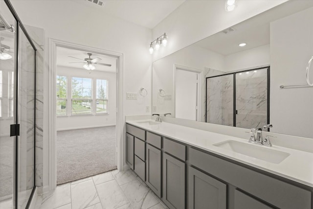 1900 Twisted Tree Ln, Mesquite, TX 75181 - full bath featuring a ceiling fan, a marble finish shower, double vanity, and marble look tiles