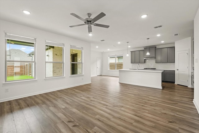 1900 Twisted Tree Ln, Mesquite, TX 75181 - unfurnished living room featuring dark wood finished floors, recessed lighting, and ceiling fan