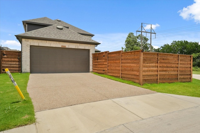 1900 Twisted Tree Ln, Mesquite, TX 75181 - view of home's exterior featuring a shingled roof and brick siding