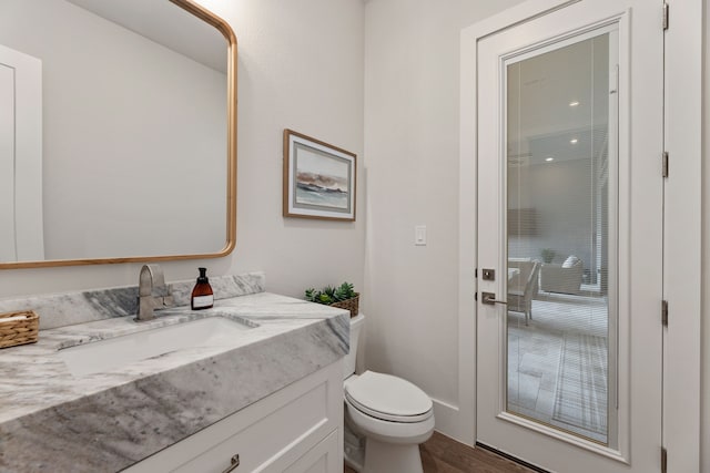 1454 Sunset Point Dr, Flower Mound, TX 75022 - half bath featuring vanity and wood finished floors