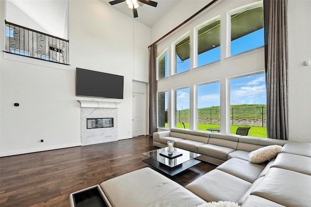 1018 Cascading Creek Dr, Rockwall, TX 75087 - living room with high vaulted ceiling, a ceiling fan, wood finished floors, and a high end fireplace