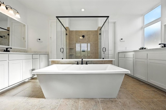1018 Cascading Creek Dr, Rockwall, TX 75087 - bathroom featuring vanity, a shower stall, a freestanding bath, and recessed lighting