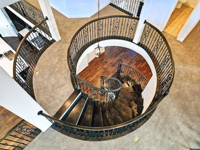 1018 Cascading Creek Dr, Rockwall, TX 75087 - stairway with carpet, a chandelier, and a towering ceiling
