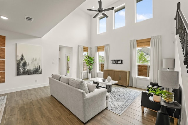 2100 Jade Forest Ln, Mesquite, TX 75181 - living area featuring stairs, a ceiling fan, a towering ceiling, recessed lighting, and wood finished floors