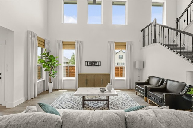 2100 Jade Forest Ln, Mesquite, TX 75181 - living room with a towering ceiling, stairway, and wood finished floors