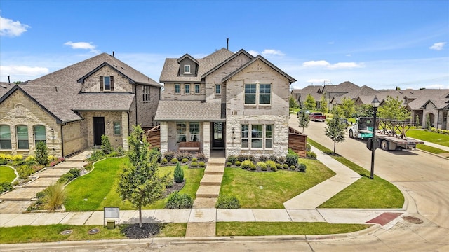 2100 Jade Forest Ln, Mesquite, TX 75181 - view of front facade with stone siding, a residential view, brick siding, and a front yard