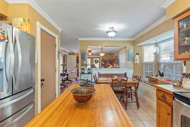 2913 David Dr, Rowlett, TX 75088 - dining room with ornamental molding, light tile patterned floors, and ceiling fan