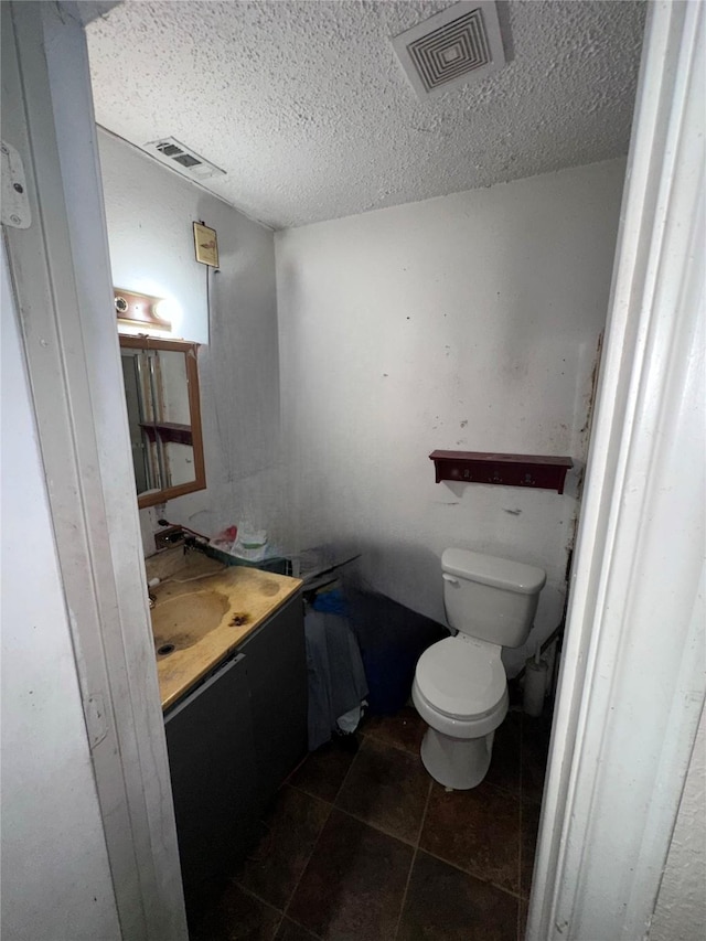116 Maxwell Rd, Hackberry, TX 75036 - bathroom featuring vanity, a textured ceiling, and tile patterned floors