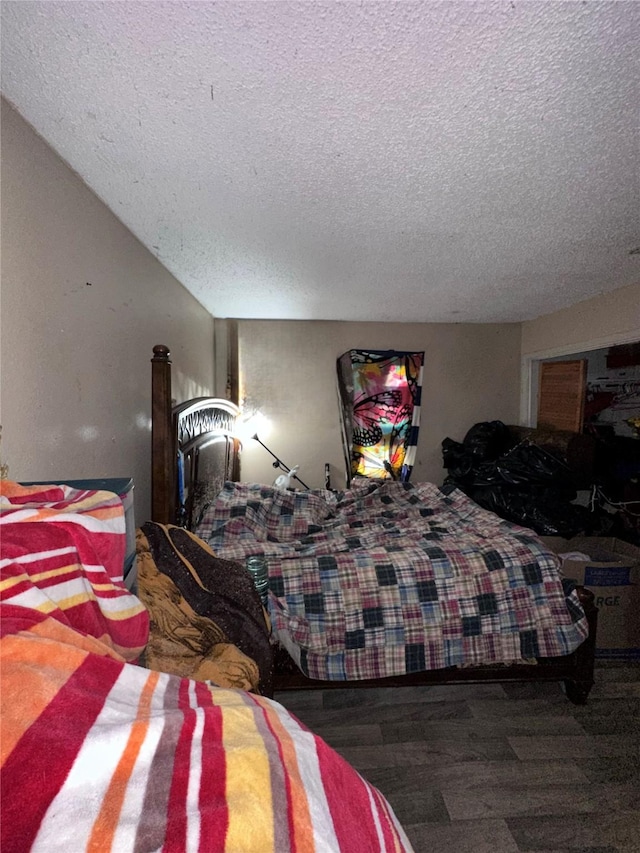 116 Maxwell Rd, Hackberry, TX 75036 - bedroom featuring a textured ceiling and wood finished floors