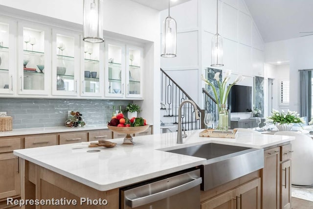 3613 Barrel Ln, Aubrey, TX 76227 - kitchen featuring stainless steel dishwasher, glass insert cabinets, pendant lighting, tasteful backsplash, and a center island with sink