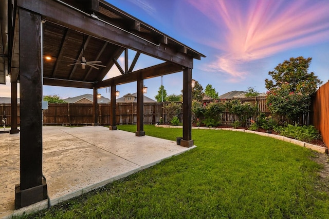 3901 Tule Ranch Rd, Fort Worth, TX 76262 - fenced backyard with ceiling fan and a patio area
