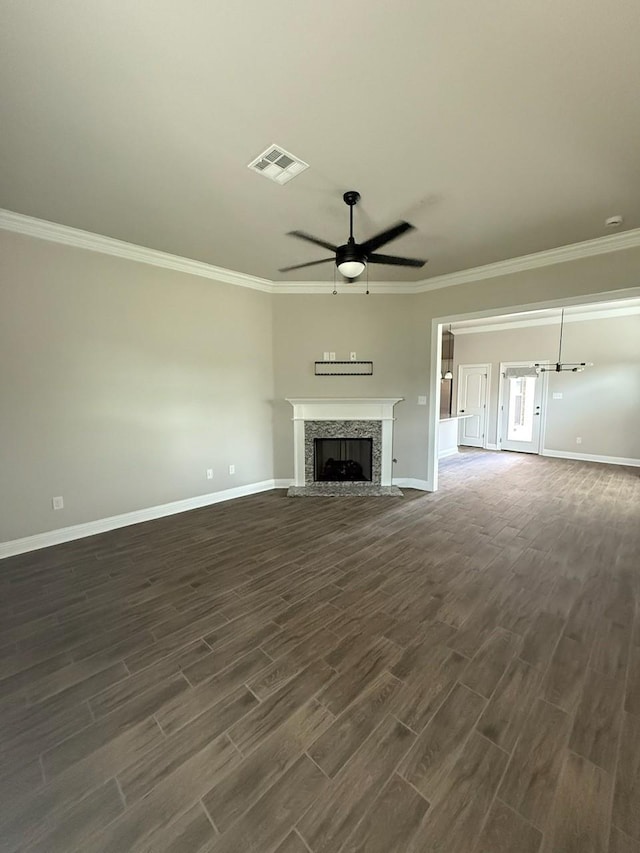 724 Esau Ave, Bossier City, LA 71111 - unfurnished living room featuring a ceiling fan, dark wood-type flooring, ornamental molding, and a fireplace with raised hearth