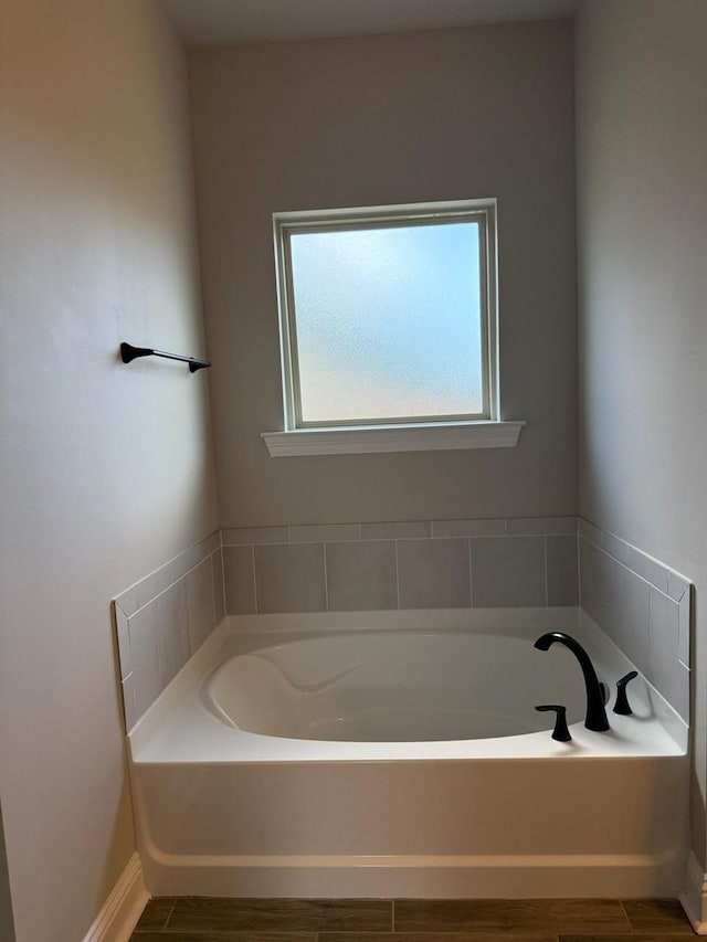 724 Esau Ave, Bossier City, LA 71111 - bathroom with a bath and wood finished floors