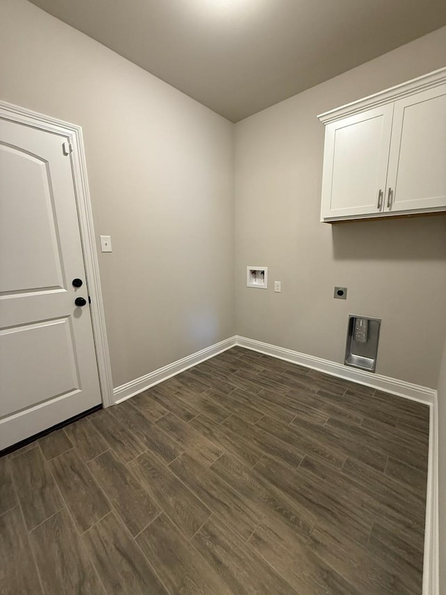 724 Esau Ave, Bossier City, LA 71111 - laundry area featuring dark wood finished floors, hookup for a washing machine, cabinet space, and hookup for an electric dryer
