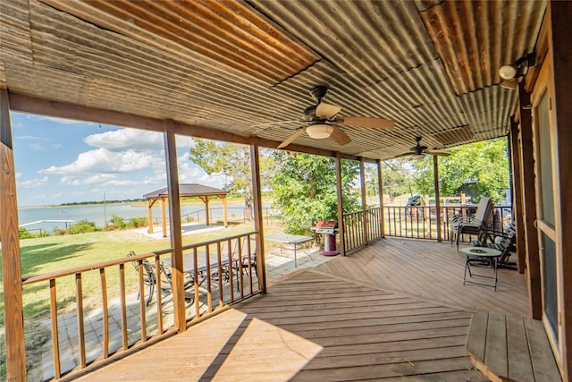 9504 County Road 197, Breckenridge, TX 76424 - wooden terrace with a water view, a gazebo, a ceiling fan, and a yard