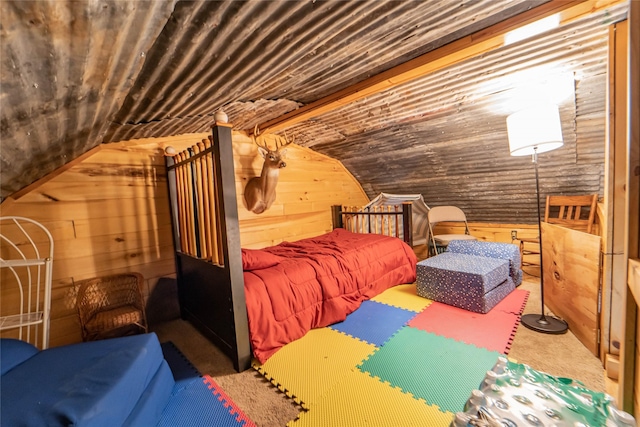 9504 County Road 197, Breckenridge, TX 76424 - bedroom featuring wood walls, vaulted ceiling, and carpet flooring