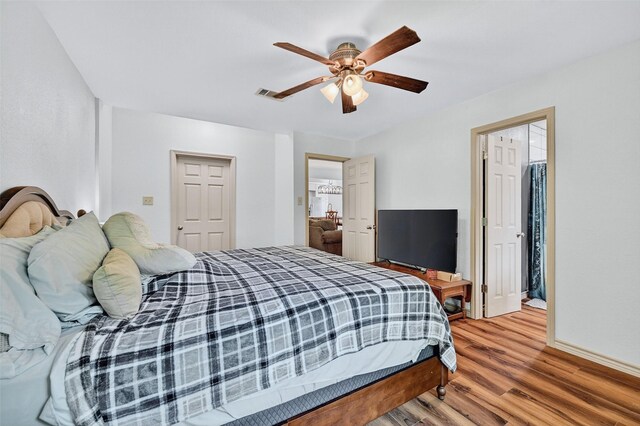 1326 W Bond St, Denison, TX 75020 - bedroom featuring wood finished floors and ceiling fan