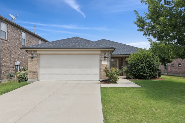913 Lovebird Ln, Little Elm, TX 75068 - ranch-style home with concrete driveway, a shingled roof, a front lawn, an attached garage, and brick siding