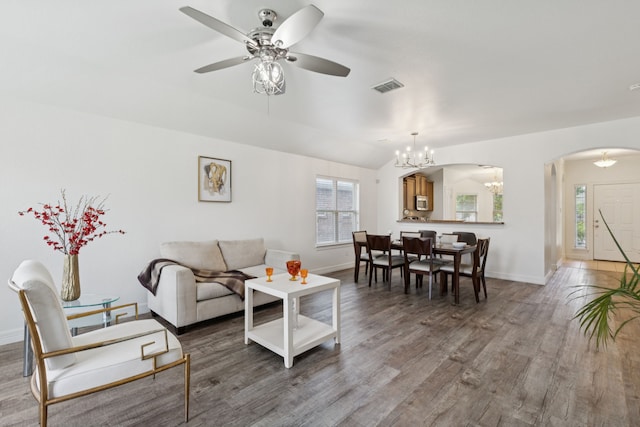 913 Lovebird Ln, Little Elm, TX 75068 - living room with a chandelier, arched walkways, a ceiling fan, wood finished floors, and lofted ceiling